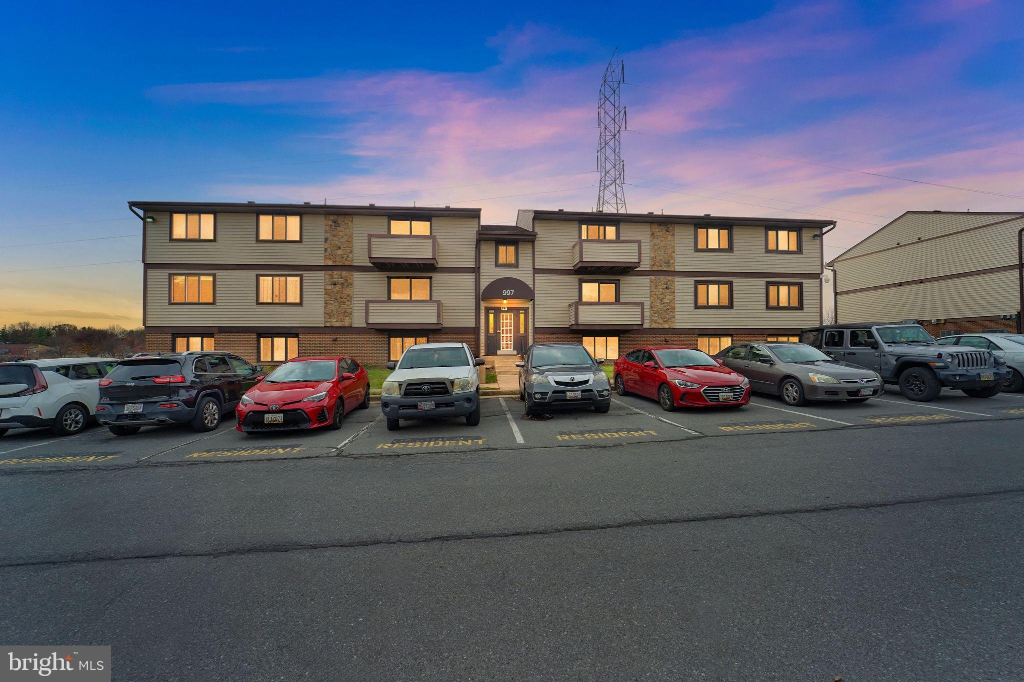 997 Heather Ridge Drive, Unit 3G Frederick, MD 21702 - Photo 14 of 14 a front view of a house with parking