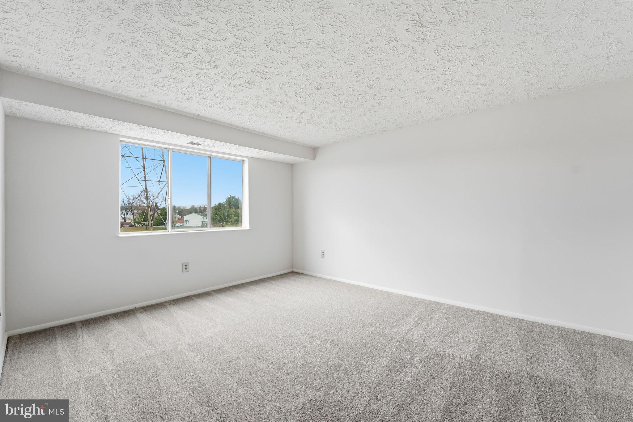 997 Heather Ridge Drive, Unit 3G Frederick, MD 21702 - Photo 5 of 14 a view of an empty room with a window