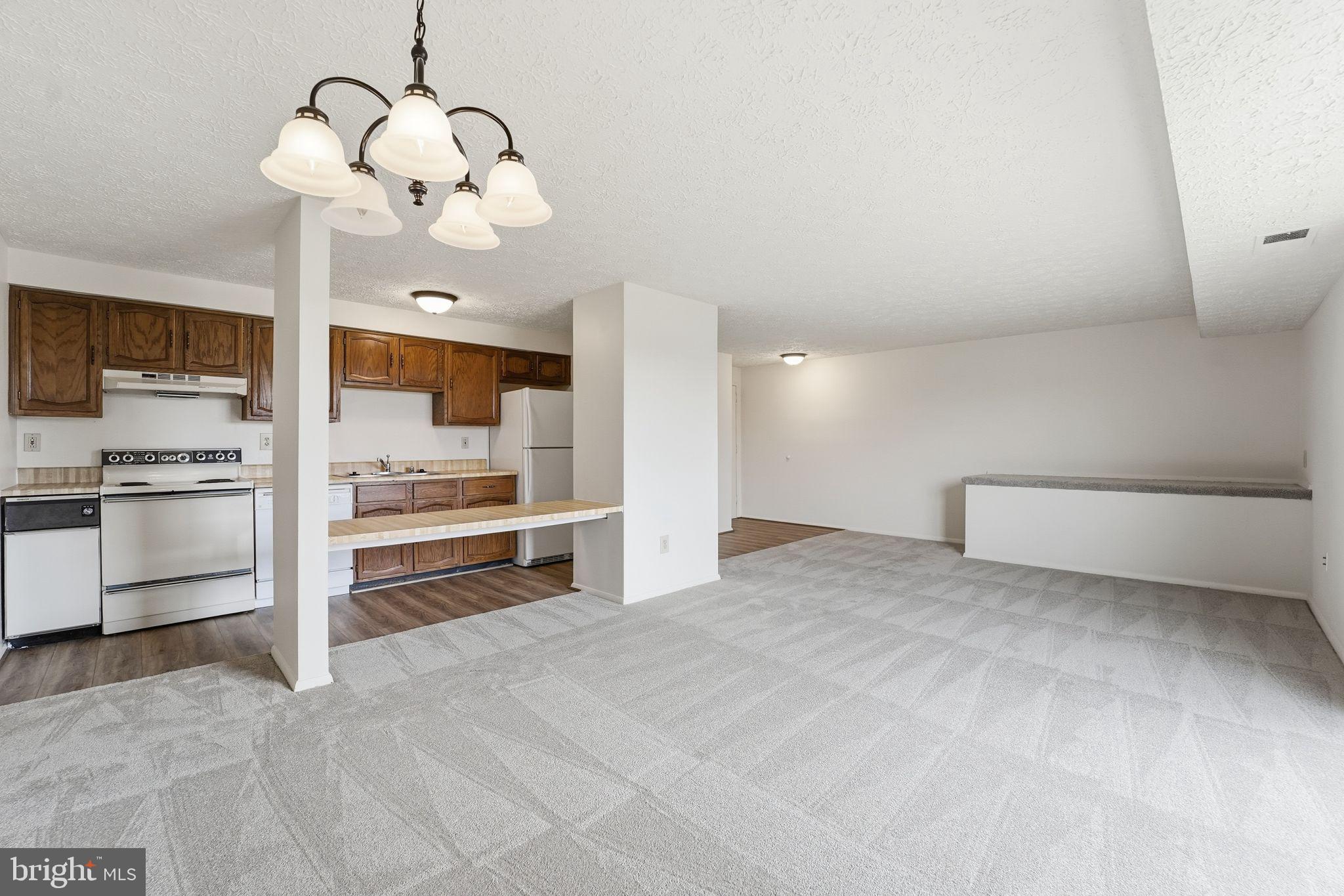 997 Heather Ridge Drive, Unit 3G Frederick, MD 21702 - Photo 6 of 14 a view of a kitchen with a stove cabinets