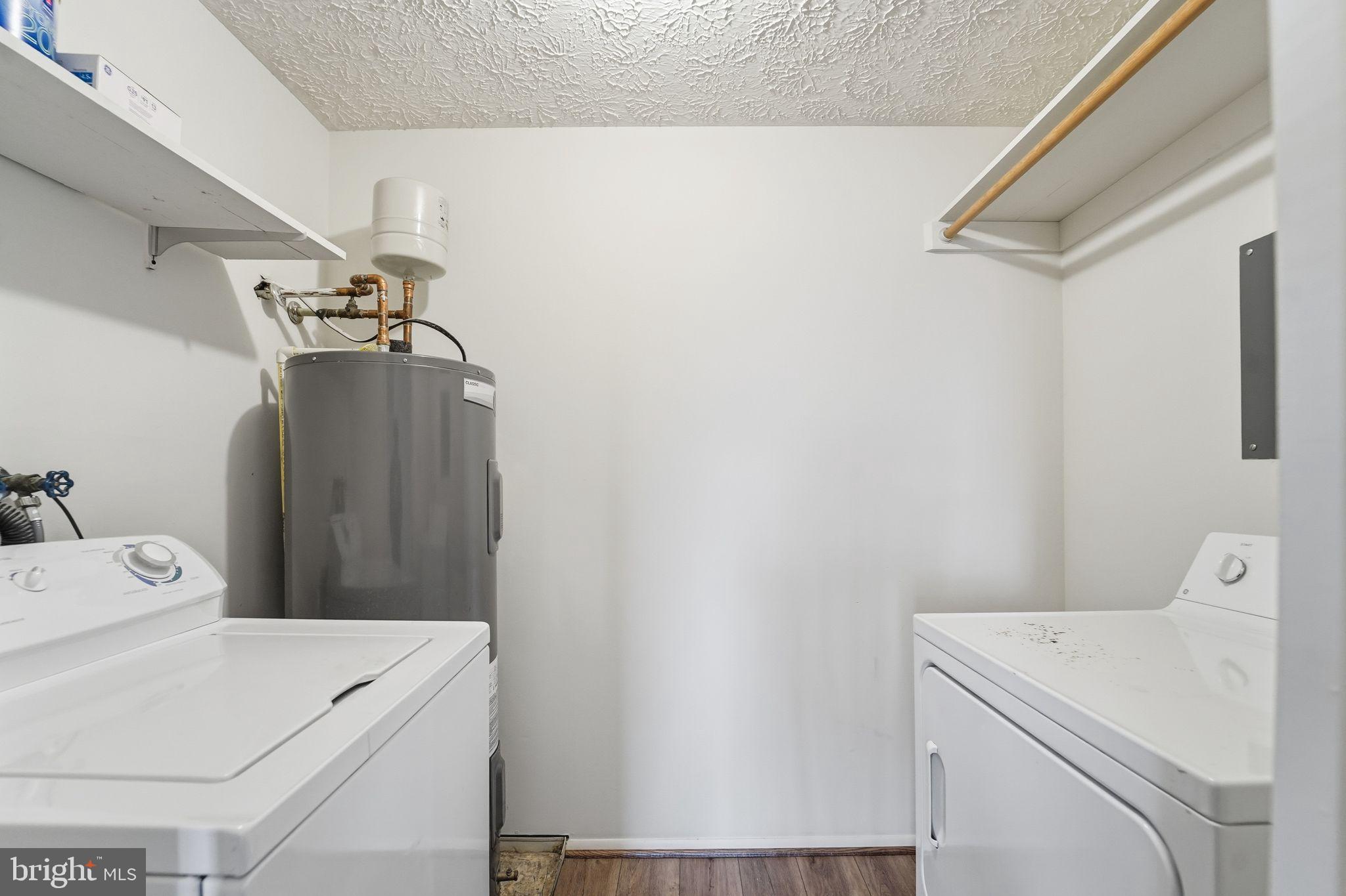 997 Heather Ridge Drive, Unit 3G Frederick, MD 21702 - Photo 10 of 14 a utility room with dryer and washer