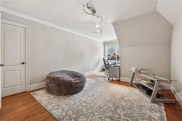 a dining room with furniture and a kitchen view