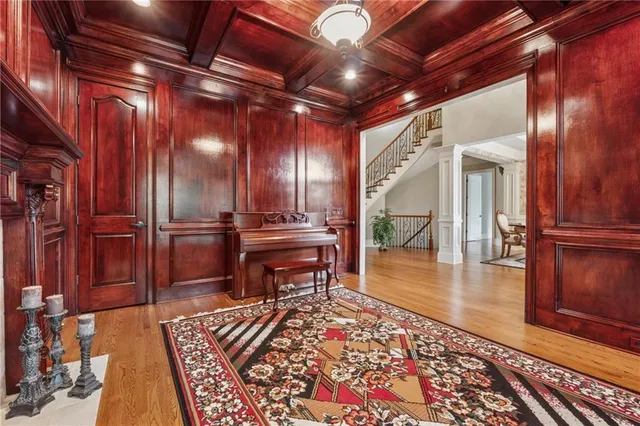 a water heater room with wooden floor