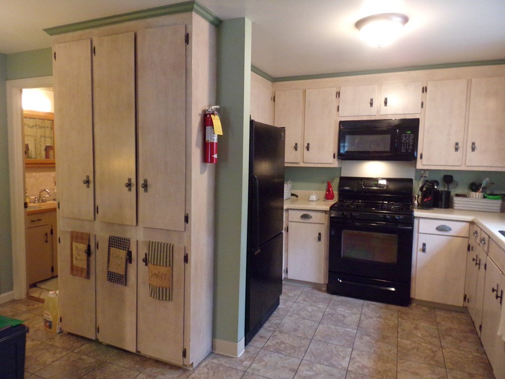 74 James Street Acushnet, MA 02743 - Photo 11 of 41 a kitchen with stainless steel appliances granite countertop a refrigerator and a stove