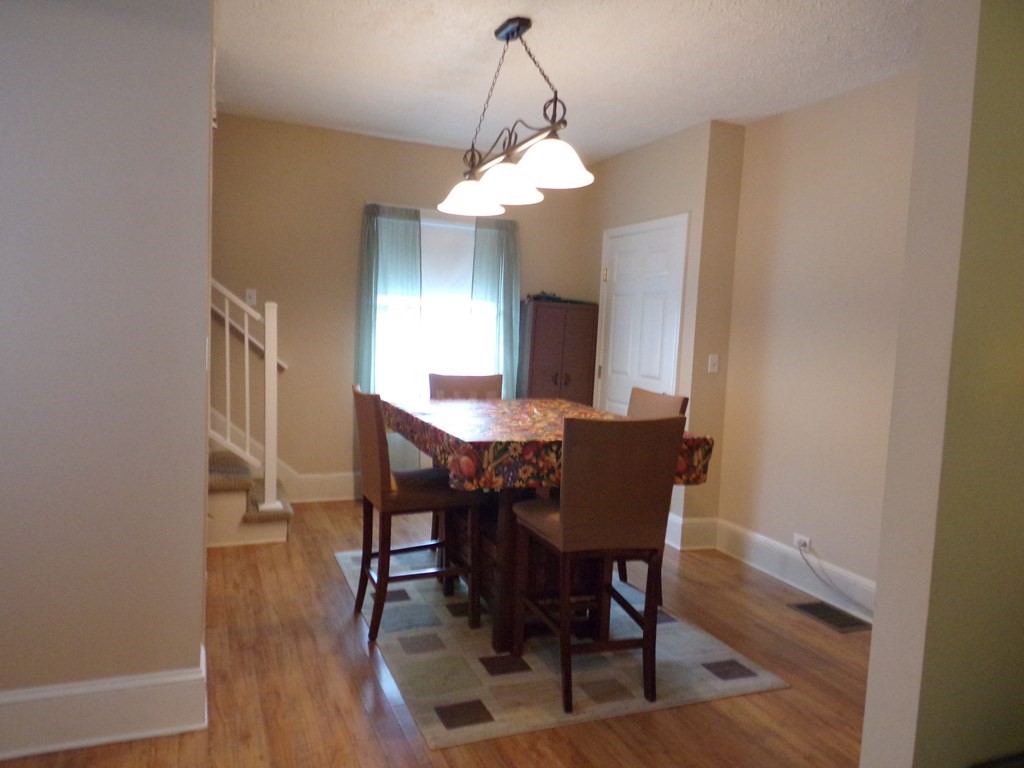 74 James Street Acushnet, MA 02743 - Photo 12 of 41 a view of a dining room with furniture and wooden floor