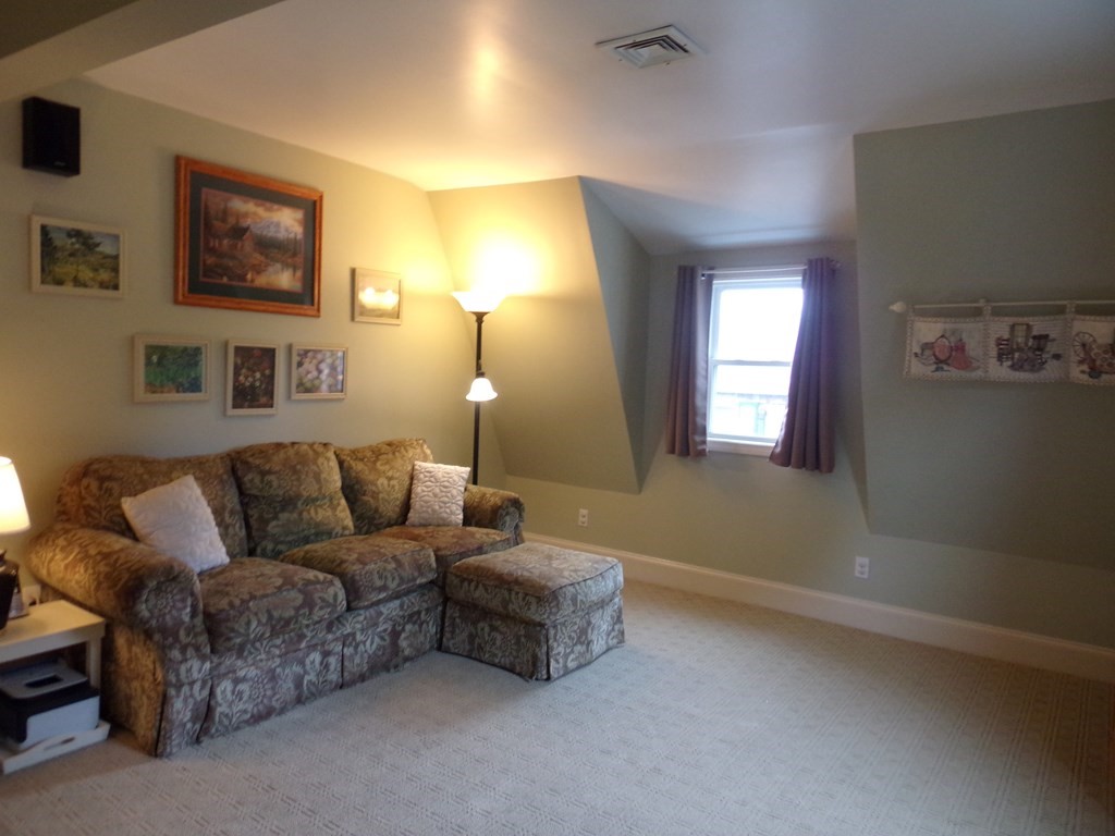 74 James Street Acushnet, MA 02743 - Photo 14 of 41 a living room with furniture and a window