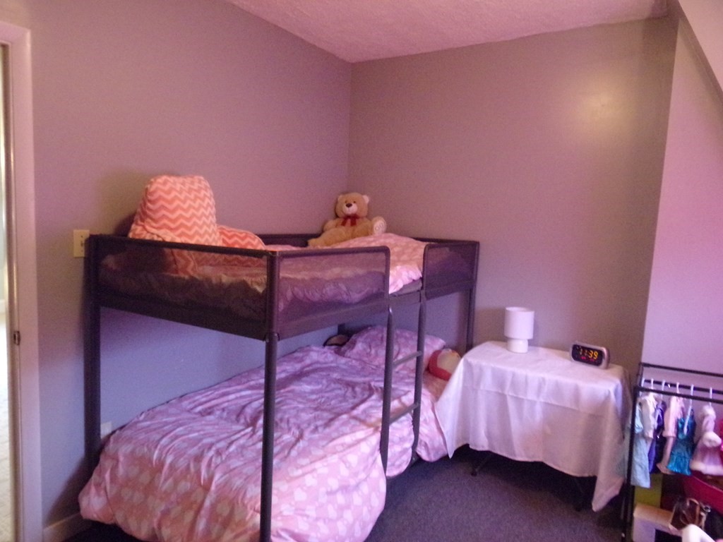 74 James Street Acushnet, MA 02743 - Photo 17 of 41 a bedroom with a bed and a lamp