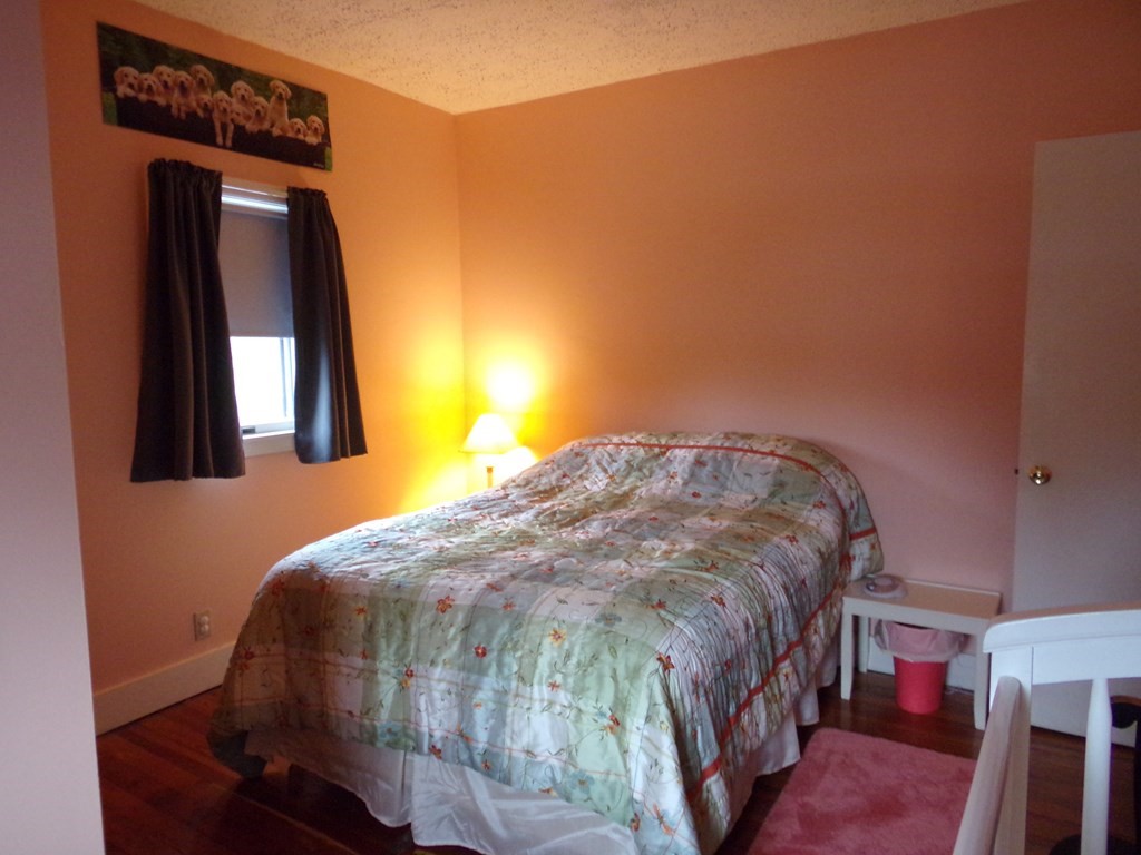 74 James Street Acushnet, MA 02743 - Photo 20 of 41 a bedroom with a bed and a mirror
