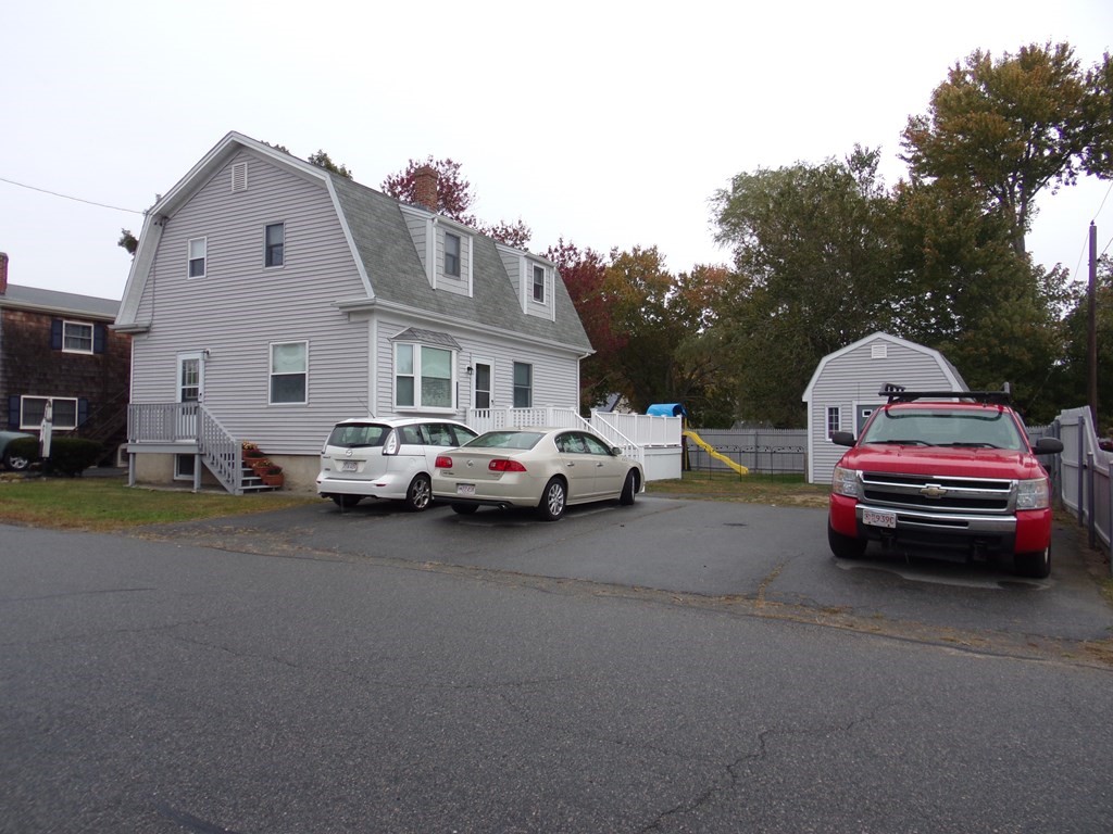 74 James Street Acushnet, MA 02743 - Photo 2 of 41 a view of street with parked cars