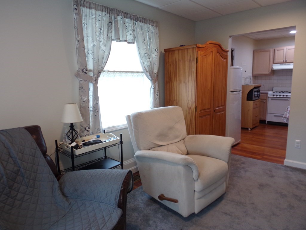 74 James Street Acushnet, MA 02743 - Photo 28 of 41 a living room with furniture and a window