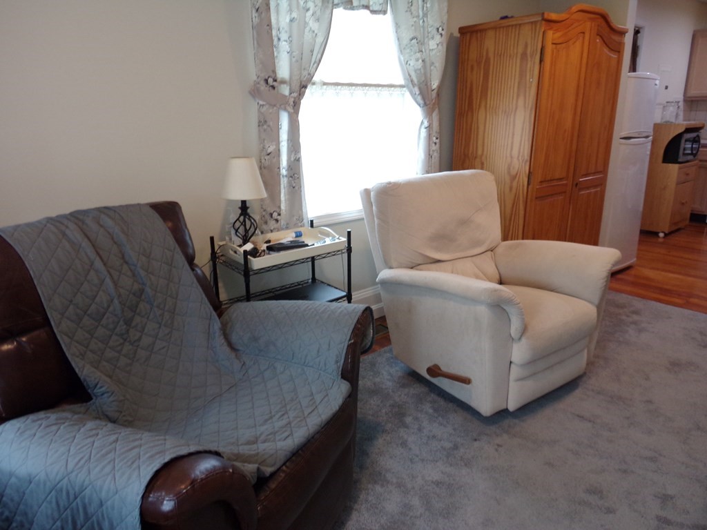 74 James Street Acushnet, MA 02743 - Photo 29 of 41 a living room with furniture and a window