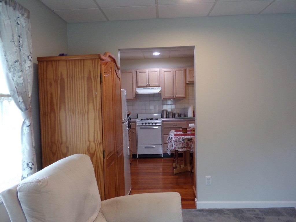 74 James Street Acushnet, MA 02743 - Photo 32 of 41 a kitchen with stainless steel appliances granite countertop a refrigerator and a stove