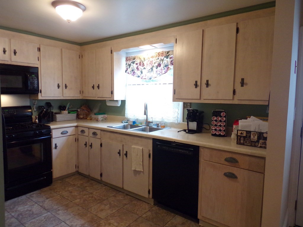 74 James Street Acushnet, MA 02743 - Photo 8 of 41 a kitchen with granite countertop white cabinets and sink