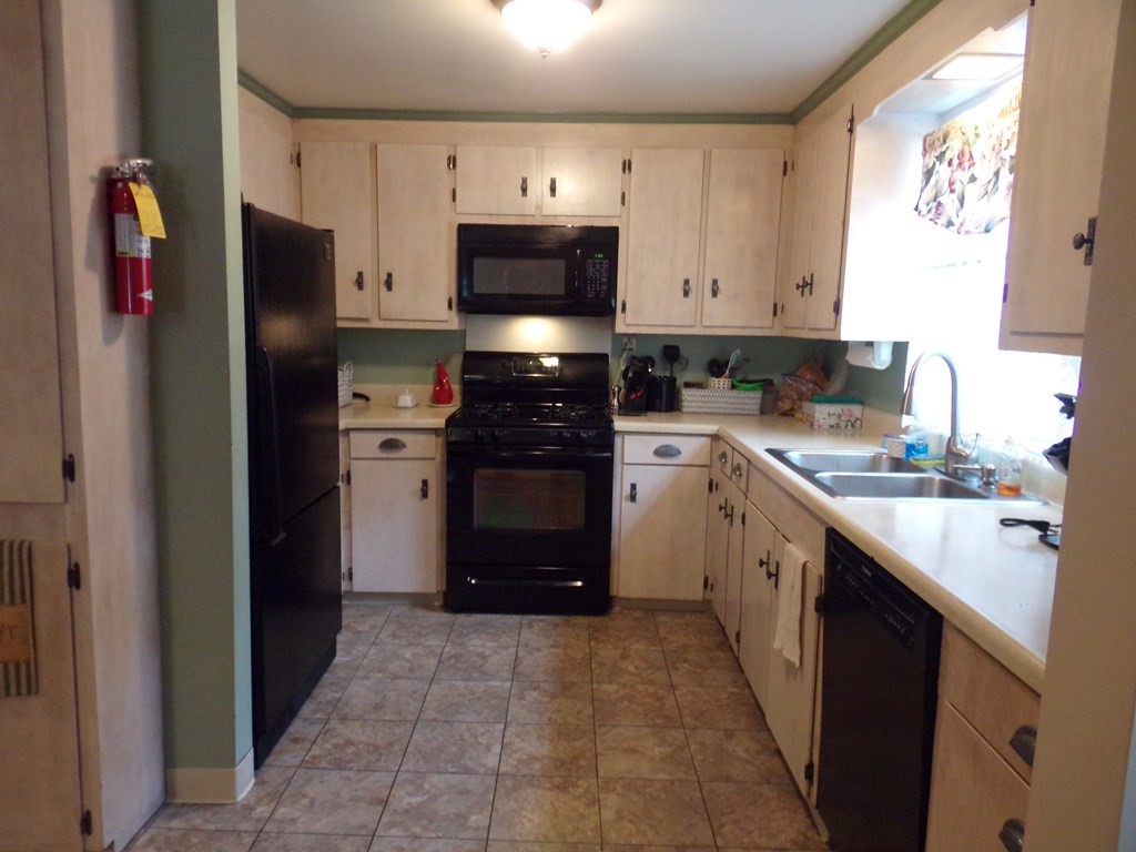 74 James Street Acushnet, MA 02743 - Photo 9 of 41 a kitchen with stainless steel appliances granite countertop a refrigerator and a sink