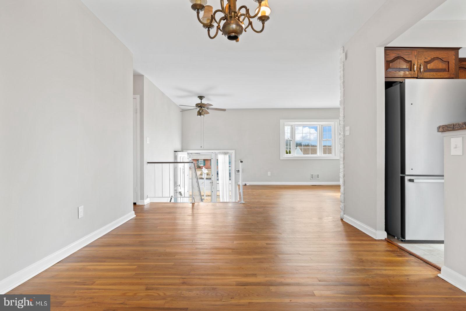 516 Nollmeyer Road Baltimore, MD 21220 - Photo 19 of 67 a view of empty room with wooden floor