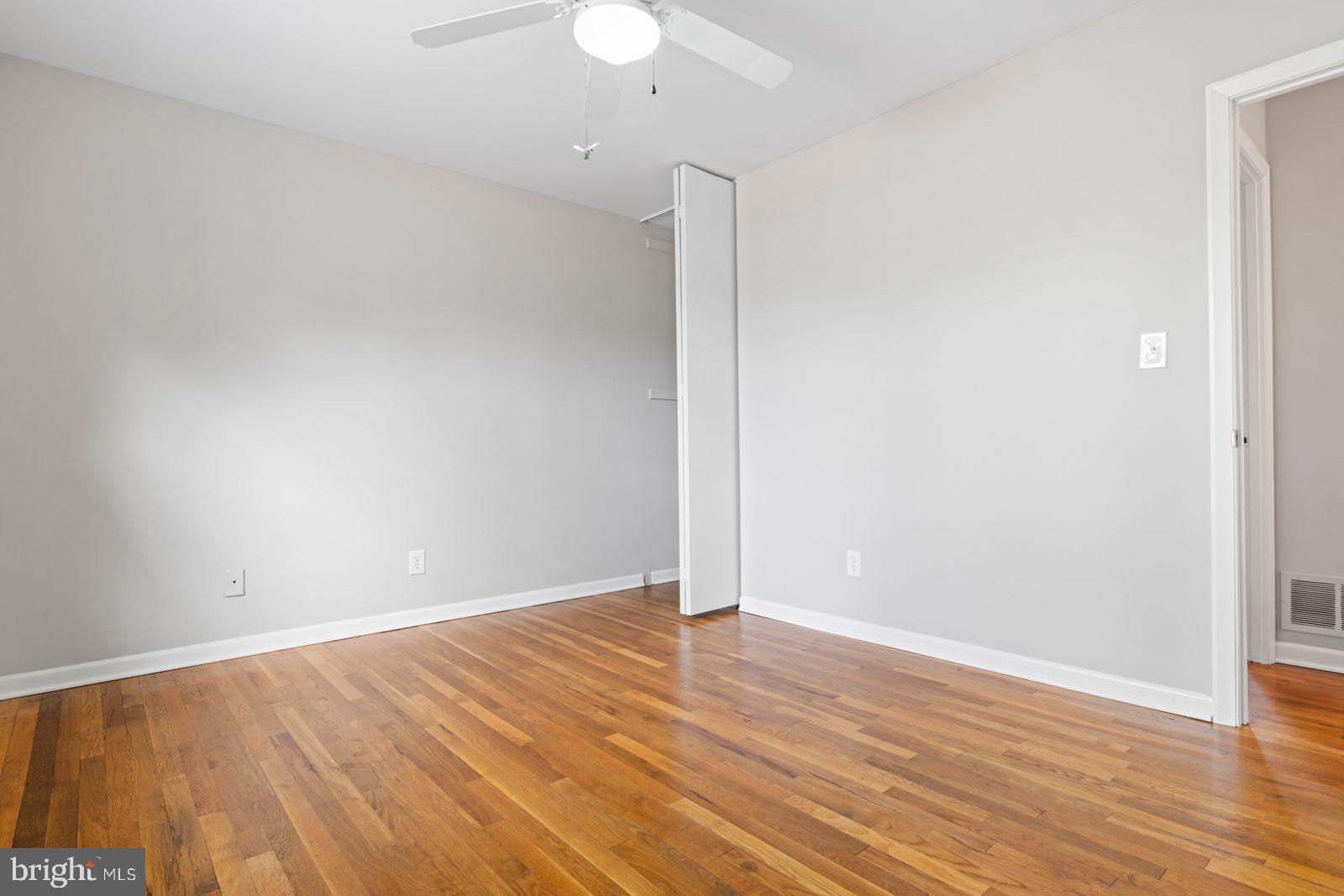 516 Nollmeyer Road Baltimore, MD 21220 - Photo 32 of 67 an empty room with wooden floor and fan