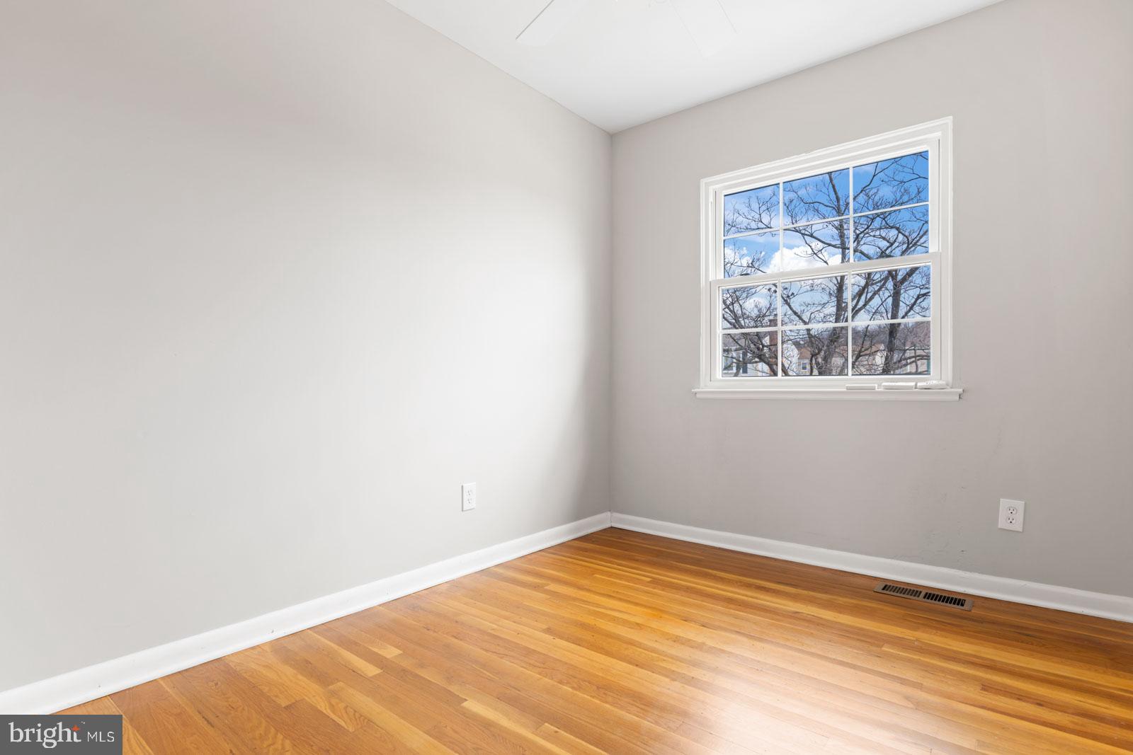 516 Nollmeyer Road Baltimore, MD 21220 - Photo 36 of 67 a view of empty room with wooden floor