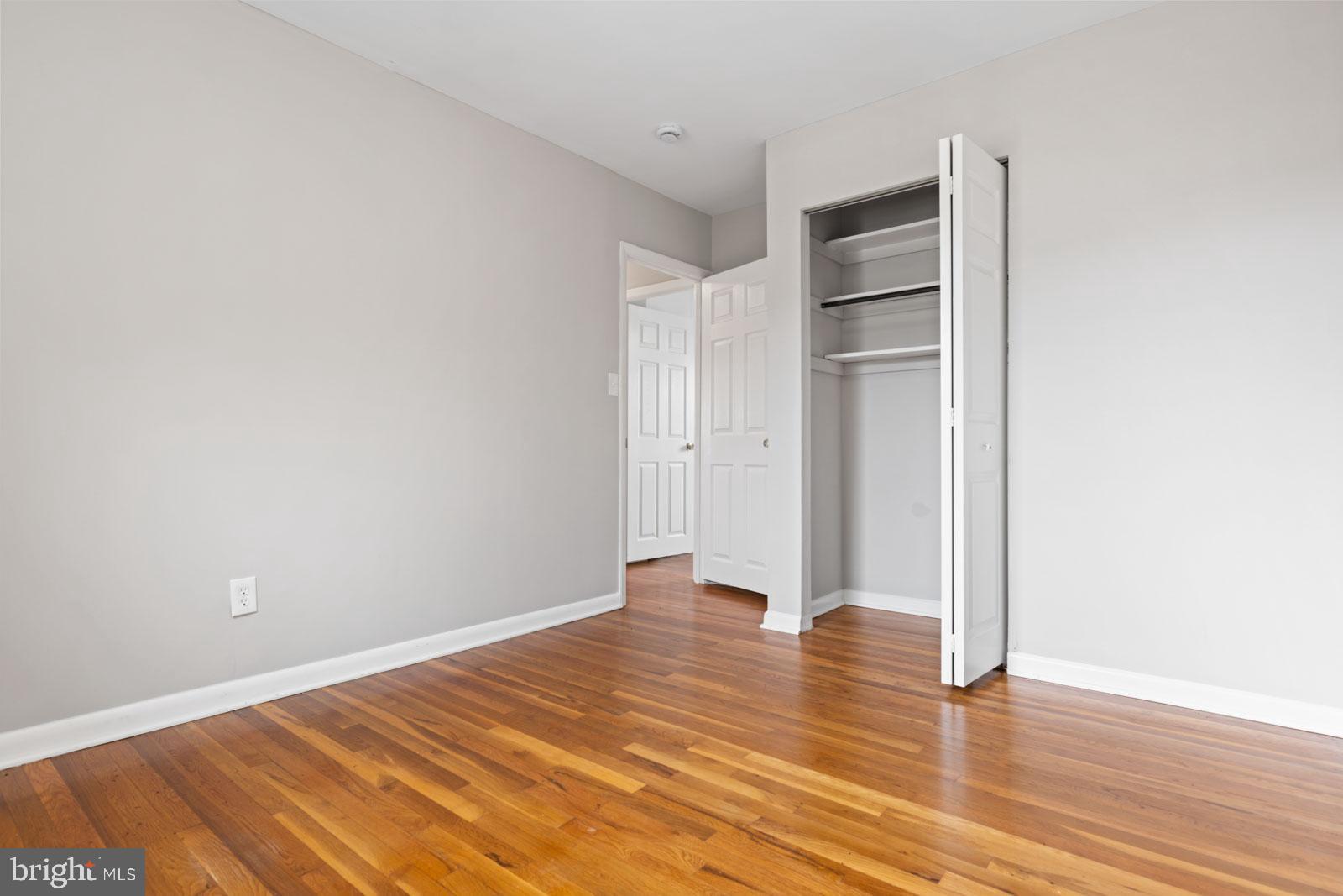 516 Nollmeyer Road Baltimore, MD 21220 - Photo 42 of 67 a view of an empty room with wooden floor