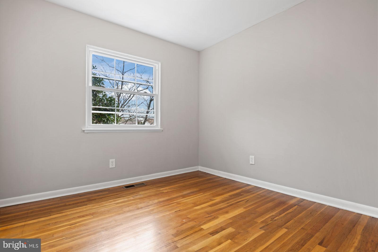516 Nollmeyer Road Baltimore, MD 21220 - Photo 43 of 67 a view of empty room with wooden floor and fan