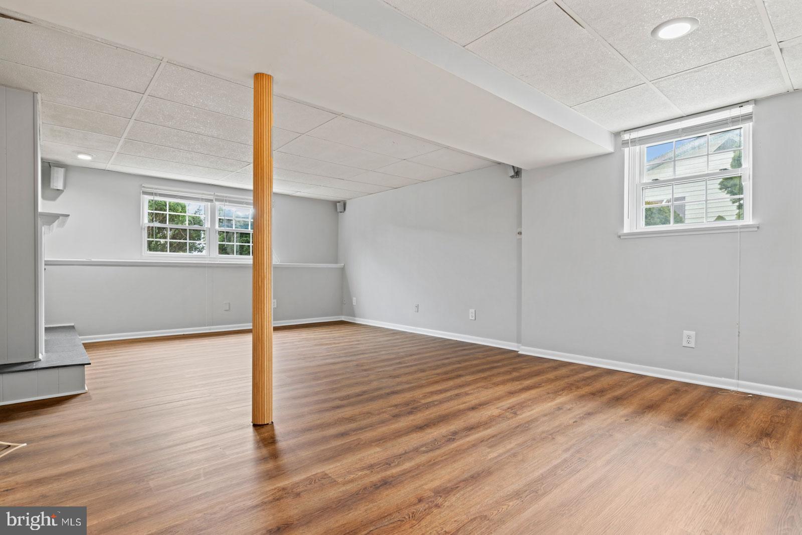 516 Nollmeyer Road Baltimore, MD 21220 - Photo 44 of 67 a view of an empty room with wooden floor and a window