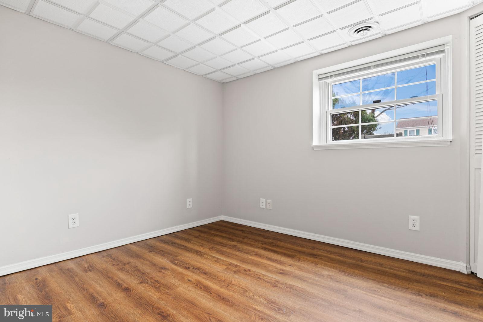 516 Nollmeyer Road Baltimore, MD 21220 - Photo 49 of 67 a view of empty room with wooden floor and fan