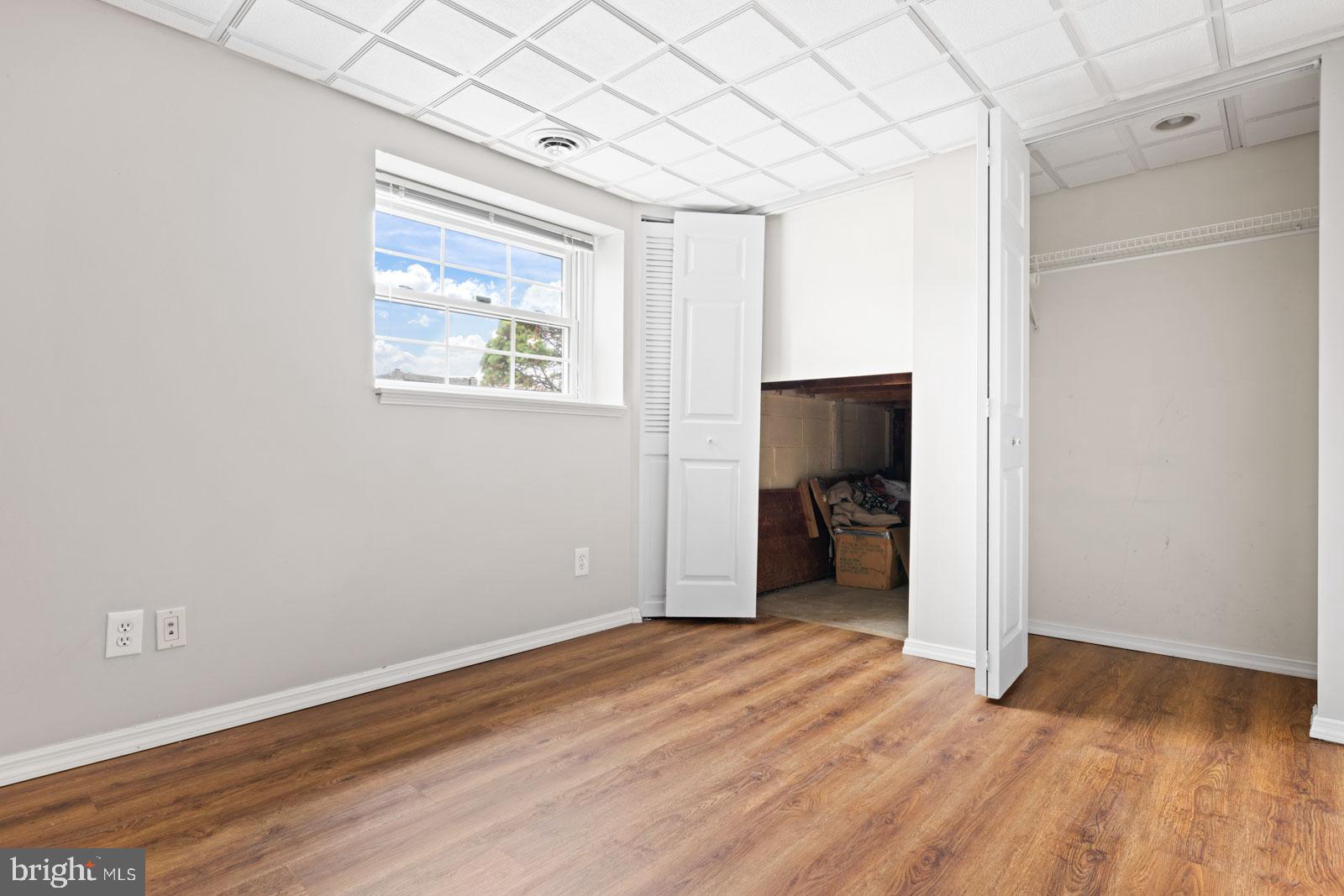 516 Nollmeyer Road Baltimore, MD 21220 - Photo 50 of 67 a view of a hallway with wooden floor and a bathroom