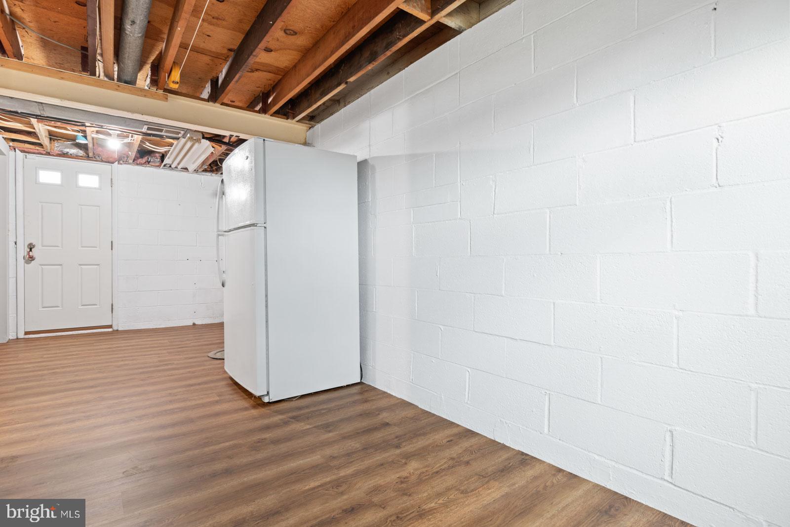 516 Nollmeyer Road Baltimore, MD 21220 - Photo 55 of 67 a view of empty room with wooden floor