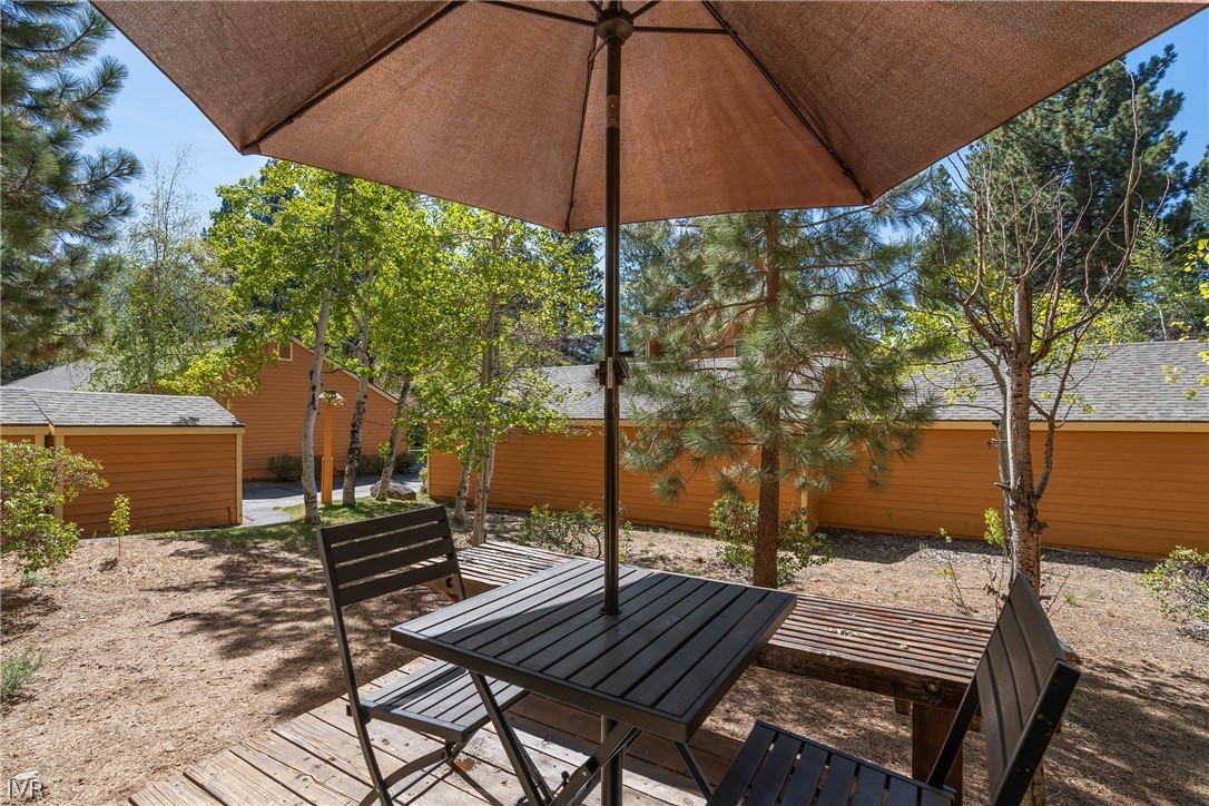 939 Incline Way, Unit 200 Incline Village, NV 89451 - Photo 12 of 27 a view of patio with a table and chairs under an umbrella
