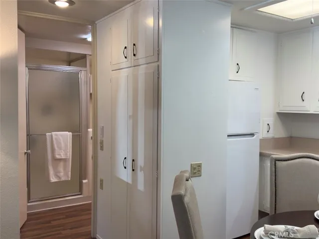 a bedroom with a bed and a mirror