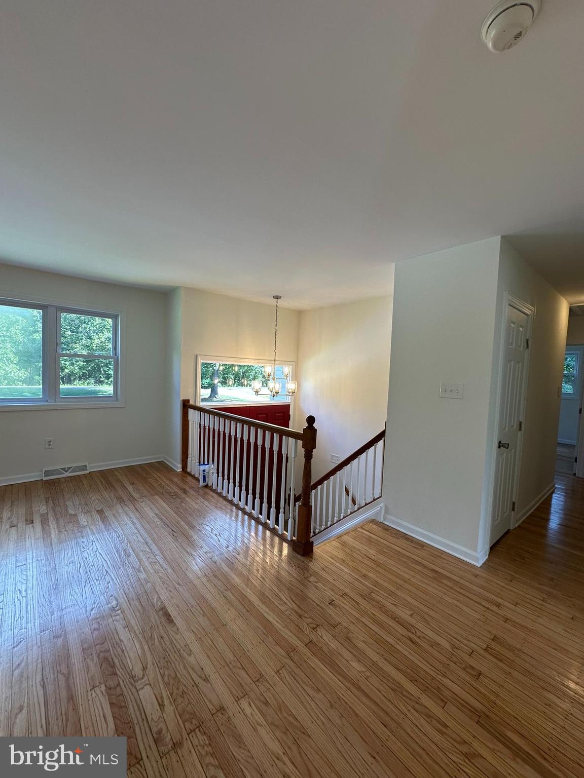 291 Union Street Glassboro, NJ 08028 - Photo 11 of 60 a view of an empty room with wooden floor and a window