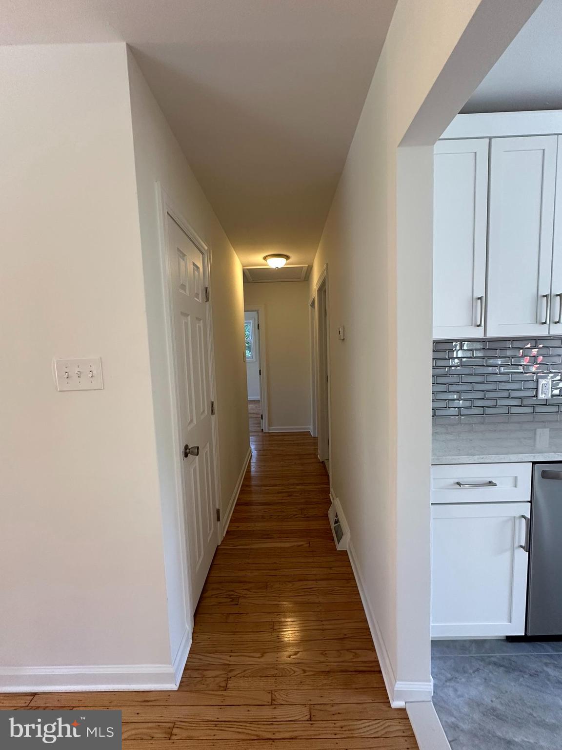 291 Union Street Glassboro, NJ 08028 - Photo 17 of 60 a view of a hallway with wooden floor and staircase