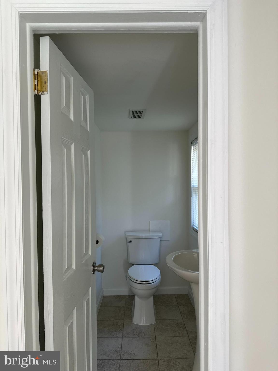 291 Union Street Glassboro, NJ 08028 - Photo 22 of 60 a white toilet sitting next to a bathroom sink