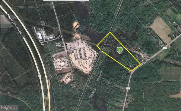 a view of a dry yard with green space and fog