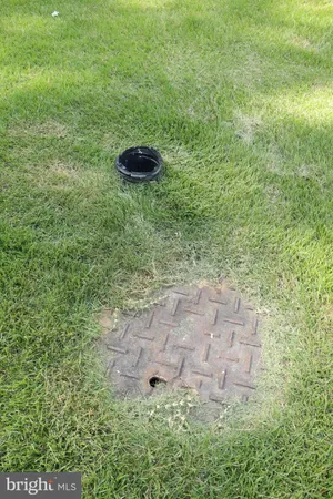 a view of a house with a yard and deck