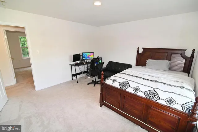 a bedroom with a bed and chair