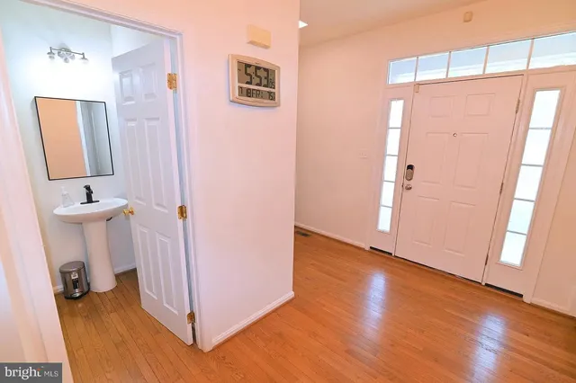 a view of bathroom with a sink and mirror
