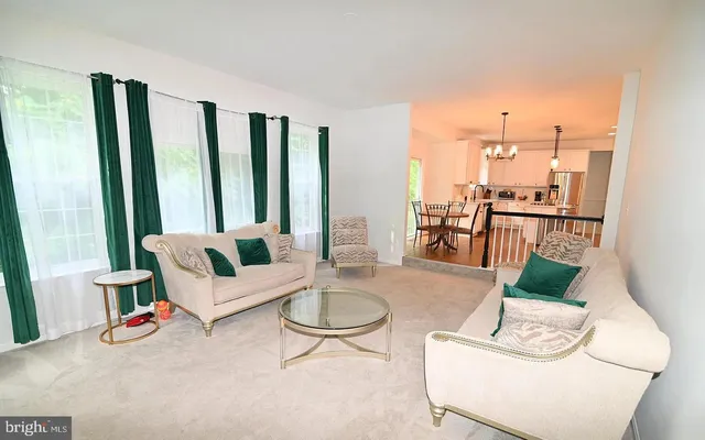 a living room with furniture and a table