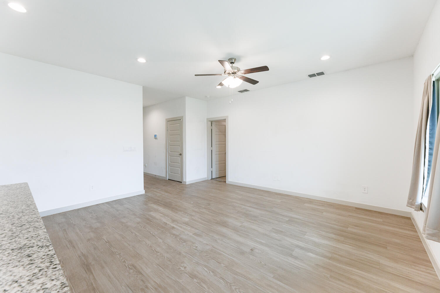 2305 150th Street Lubbock, TX 79423 - Photo 6 of 39 wooden floor in an empty room