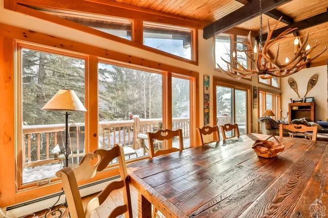 a bedroom with a large bed and a dresser