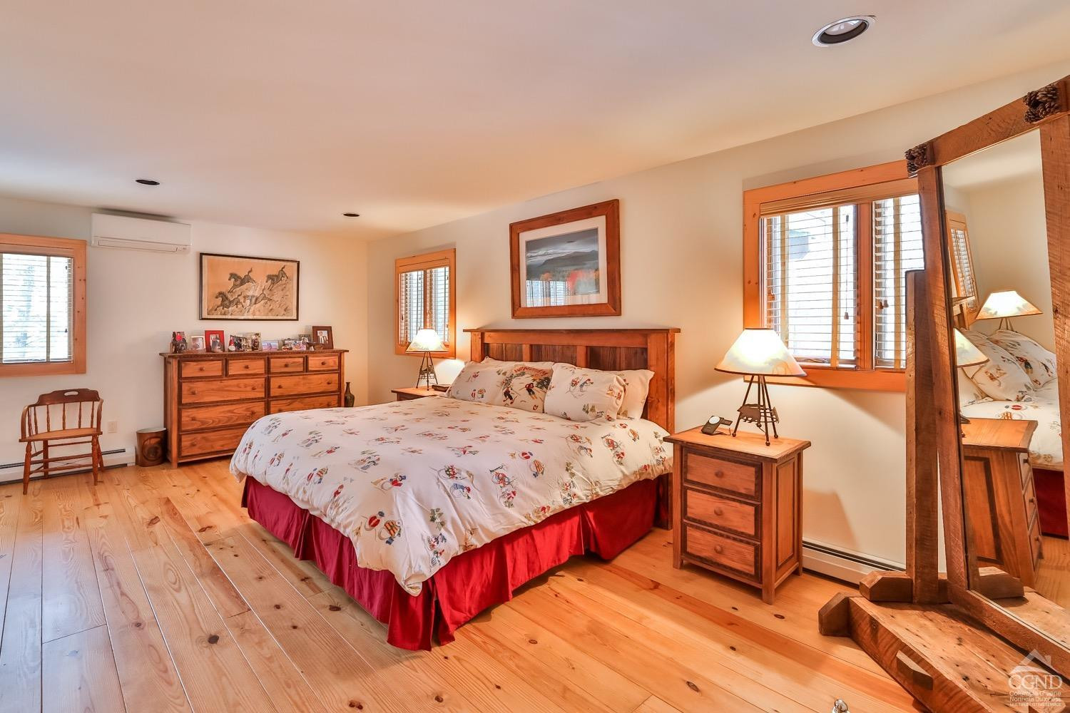 90 Club Road Windham, NY 12496 - Photo 41 of 77 a bedroom with a large bed and a dresser