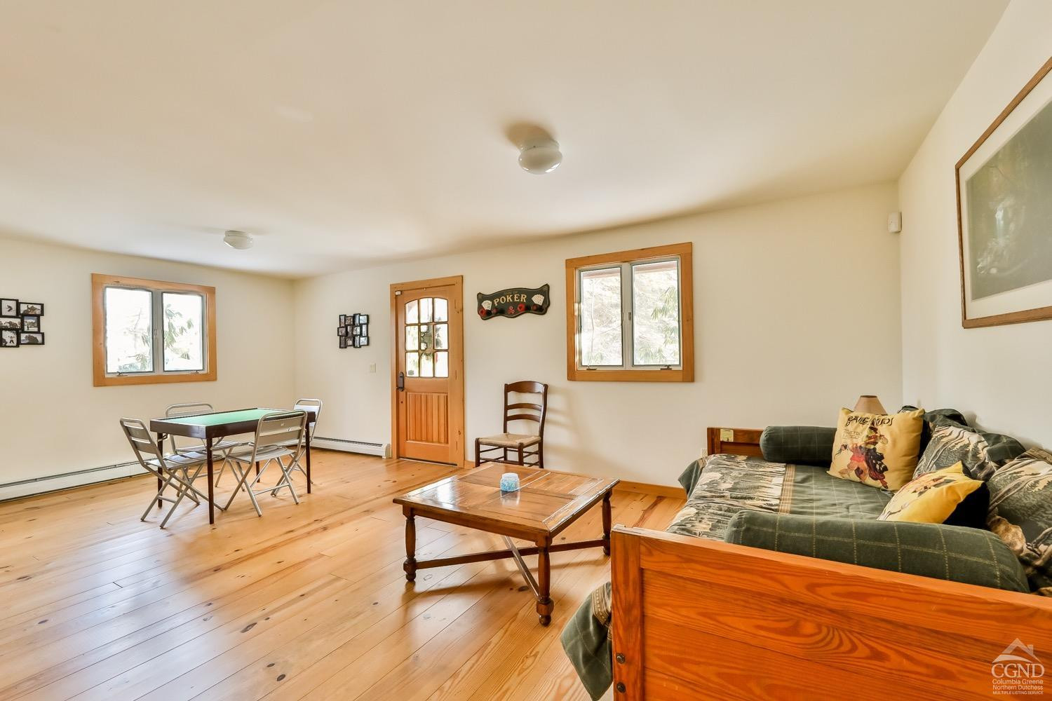 90 Club Road Windham, NY 12496 - Photo 61 of 77 a living room with furniture wooden floor and a window
