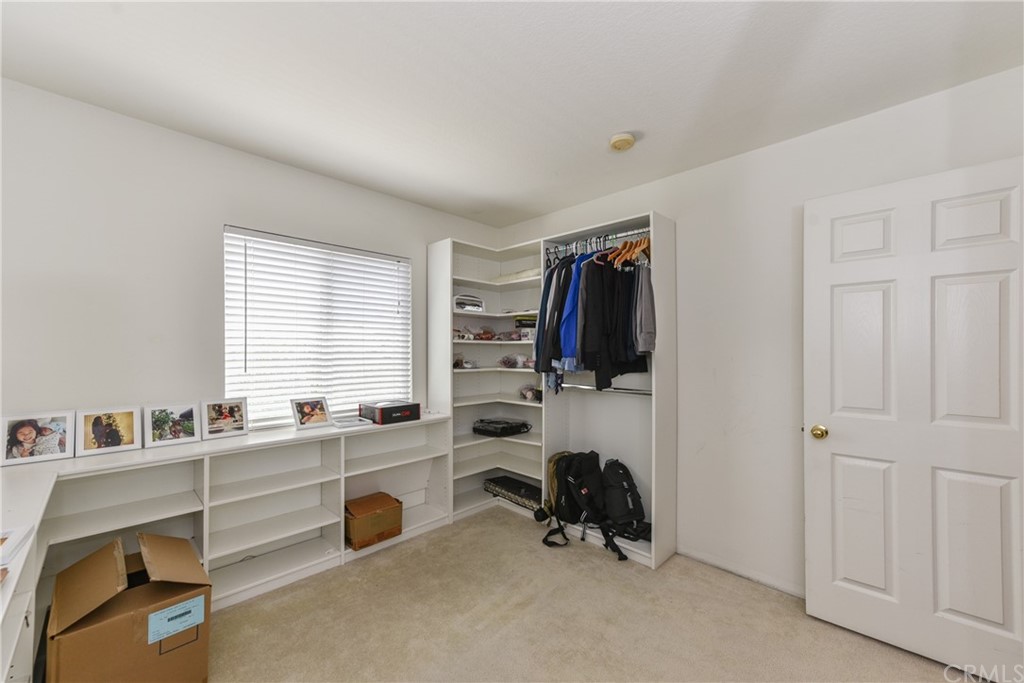 7637 Pinot Place Rancho Cucamonga, CA 91739 - Photo 18 of 39 a view of a livingroom with workspace and a window