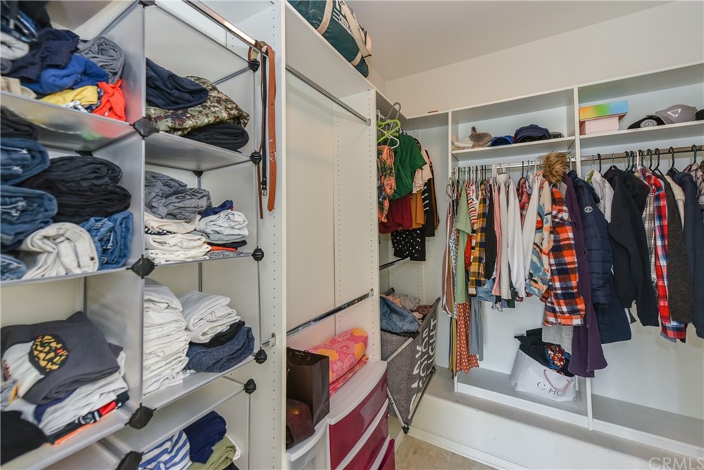 7637 Pinot Place Rancho Cucamonga, CA 91739 - Photo 24 of 39 a view of walk in closet with clothes and shoes