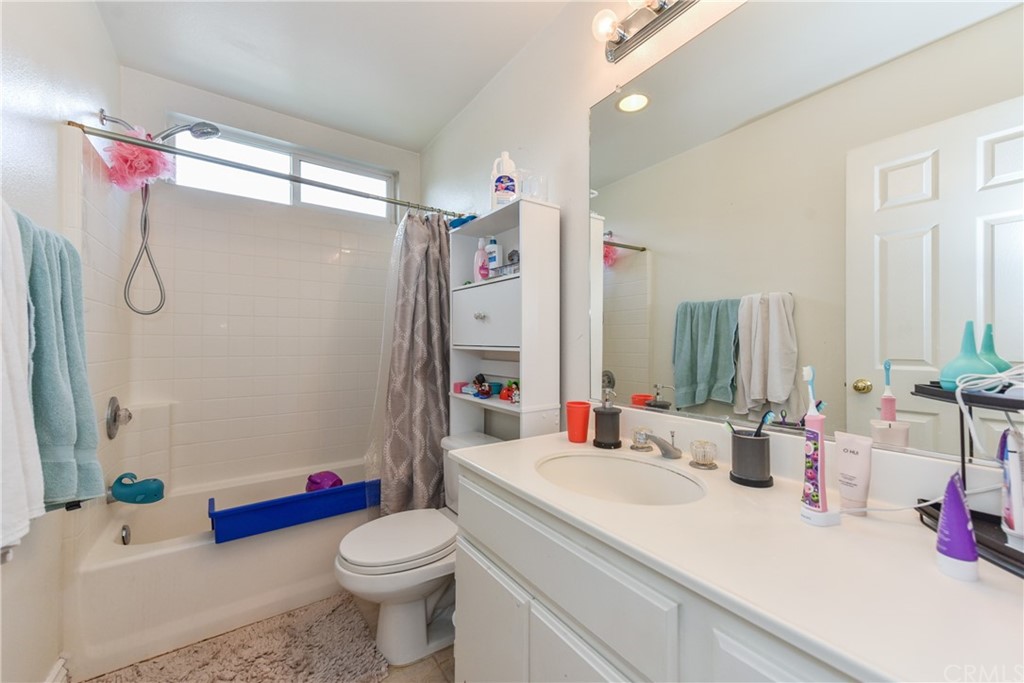 7637 Pinot Place Rancho Cucamonga, CA 91739 - Photo 26 of 39 a bathroom with a sink vanity mirror and toilet