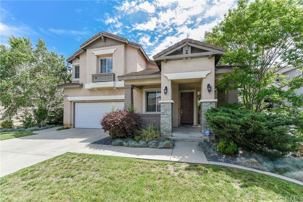 7637 Pinot Place Rancho Cucamonga, CA 91739 - Photo 3 of 39 a front view of a house with garden