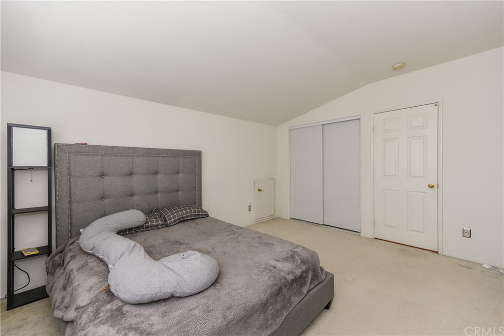 7637 Pinot Place Rancho Cucamonga, CA 91739 - Photo 31 of 39 a bedroom with a bed and a window