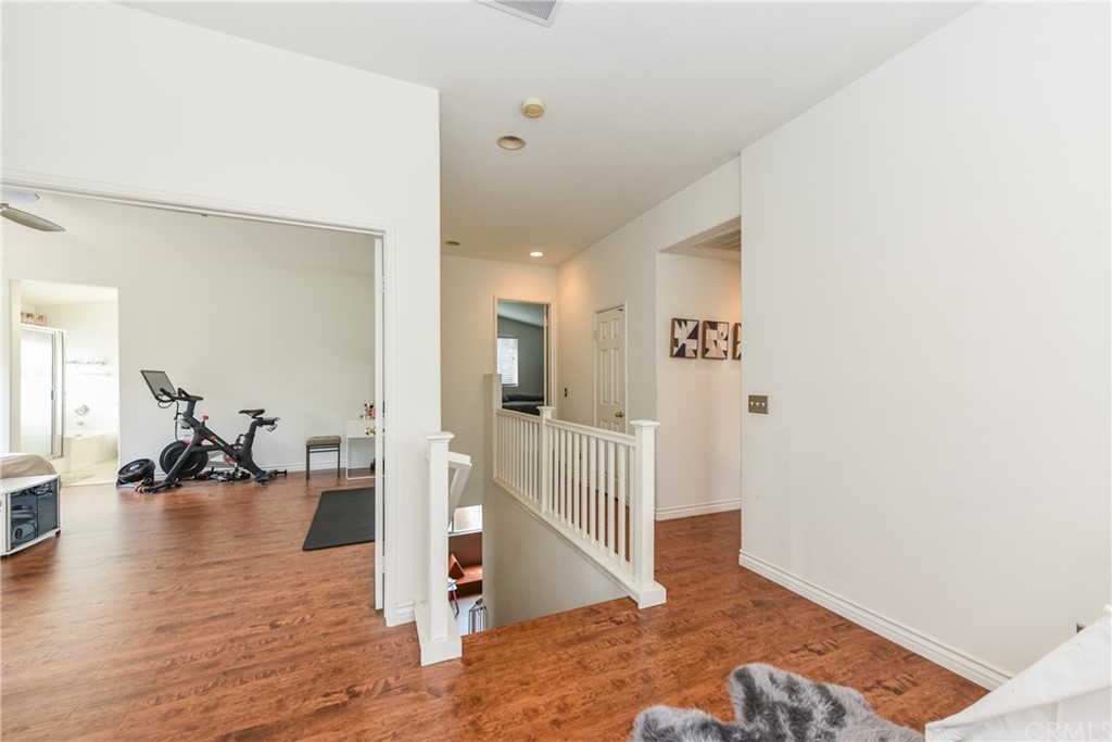 7637 Pinot Place Rancho Cucamonga, CA 91739 - Photo 33 of 39 a view of a livingroom with wooden floor and a living room