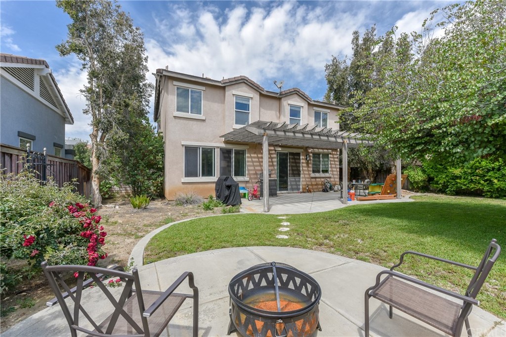 7637 Pinot Place Rancho Cucamonga, CA 91739 - Photo 38 of 39 a view of a house with backyard sitting area and garden