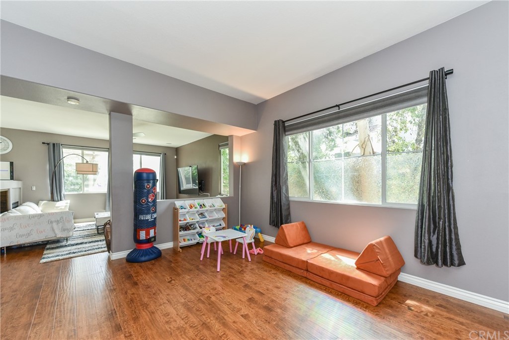 7637 Pinot Place Rancho Cucamonga, CA 91739 - Photo 5 of 39 a living room with furniture and a window