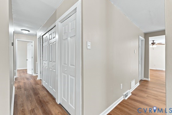 865 Sulphur Spring Road Prospect, VA 23960 - Photo 13 of 40 Hallway featuring wood-finish flooring, light neut