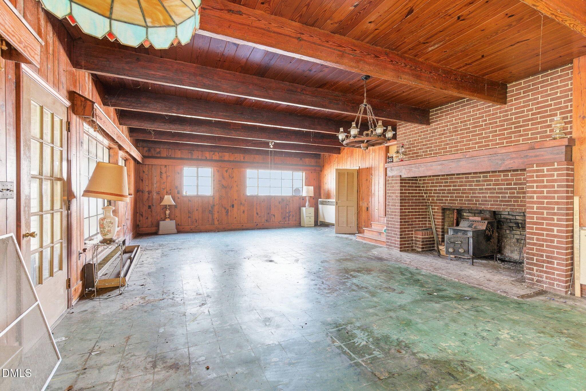 1603 Sykes Road Mebane, NC 27302 - Photo 9 of 45 a view of an empty room with a fireplace and a window